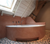 Kalkpleister Tadelakt en keramische badkuip
